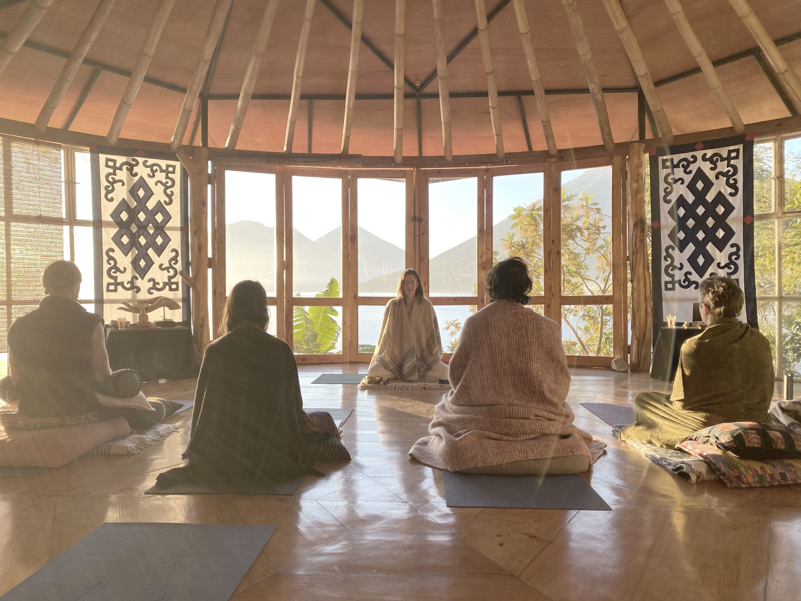 Group of people meditating with Tiffany