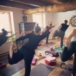 Room of people taking a yoga class